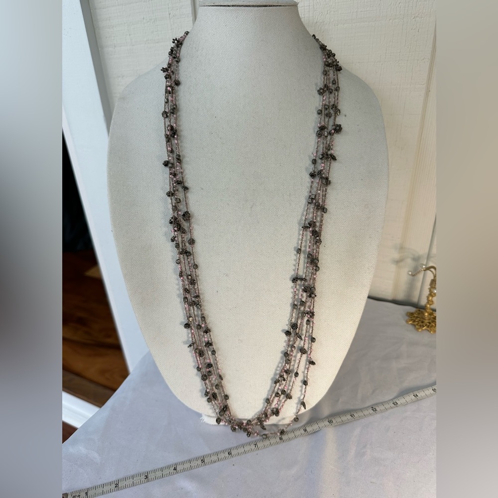 Gray multi strand crochet style pink bead necklace